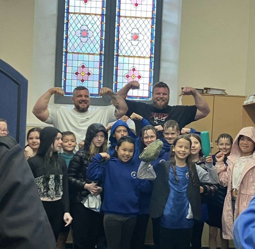 The Stoltman brothers with local primary school children at last week's 'Our Invergordon' project. They're popular contenders for the next town mural. Picture: Iona MacDonald