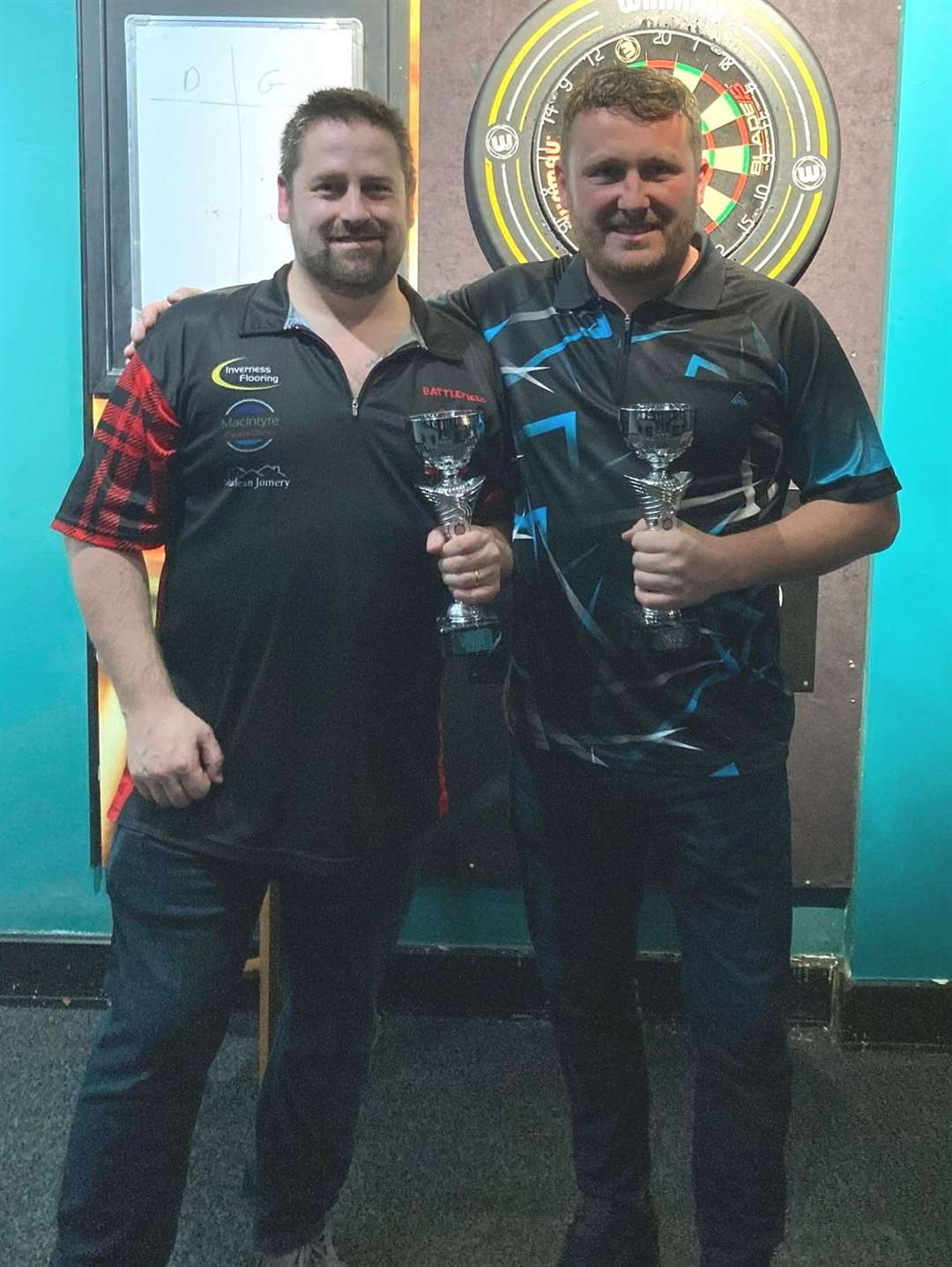 Derek Maclean and Nicky Denoon celebrate winning the A League Pairs.