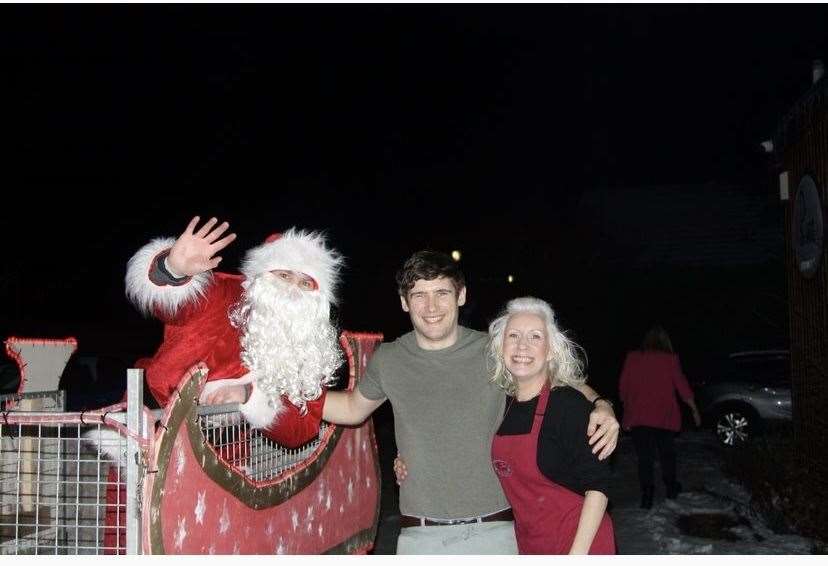 Gregor Bain and Deirdre Allison from the Pier Cafe, Lairg, popped out to greet Santa.