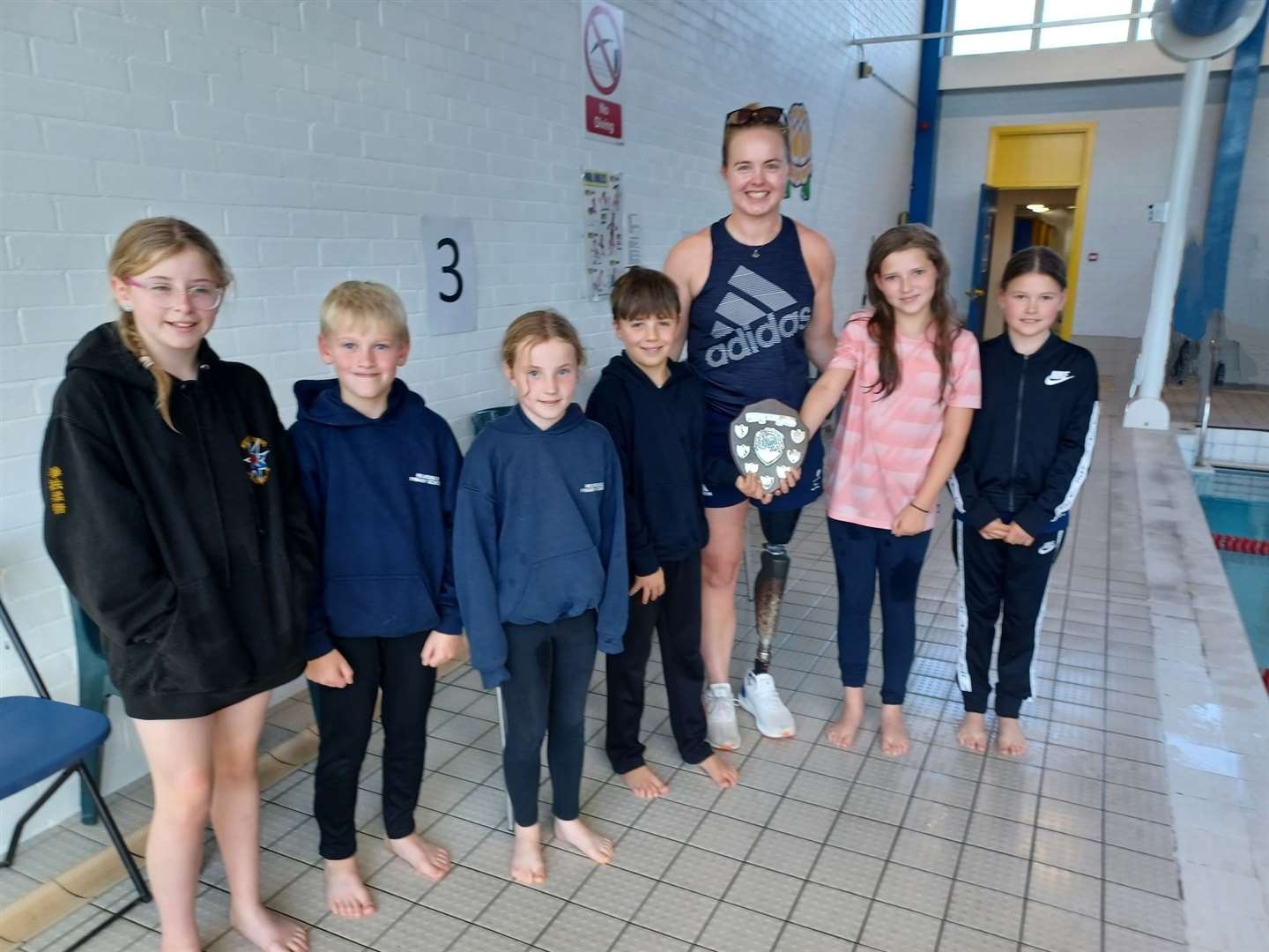 Para-athlete Hope Gordon with Helmsdale primary swimmers who won the Small Schools trophy, which has been held by Rogart since 2013. From left, Lorna Hope, Jayden Taylor, Amelia Gordon, Sholto Shaw, Olivia MacKay and Eva Murray.
