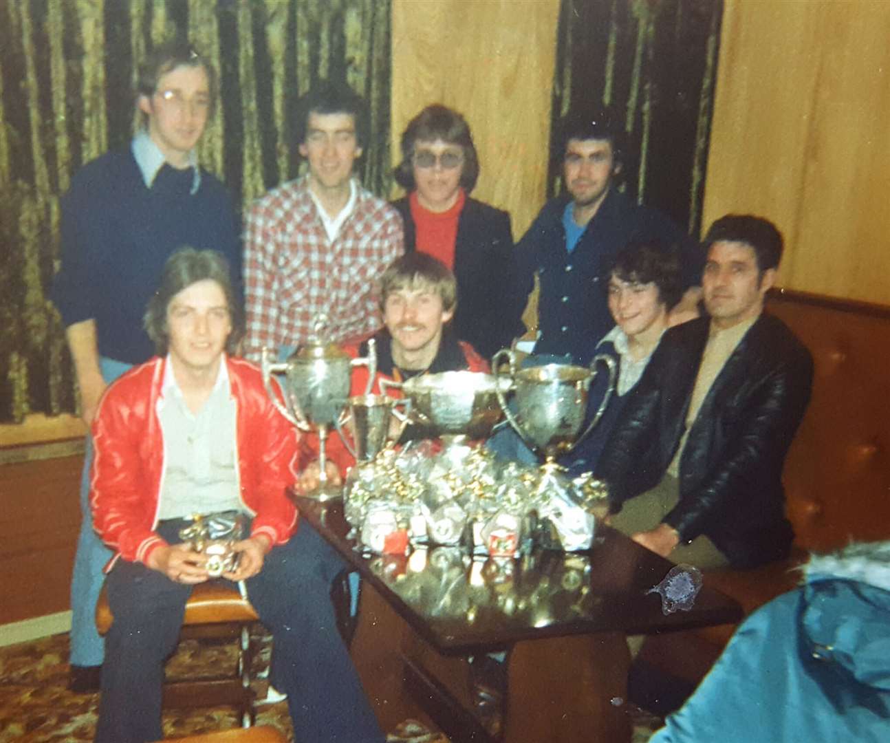Brora Wanderers committee and volunteers celebrate trophy success in 1977.
