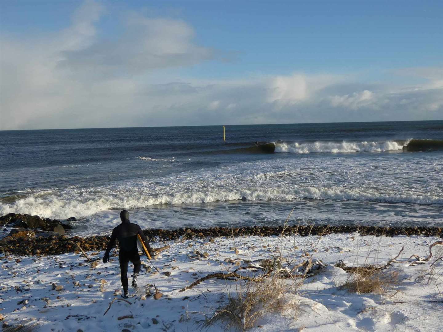 Braving the conditions at the harbour mouth in Brora. Photo: Justine Clark