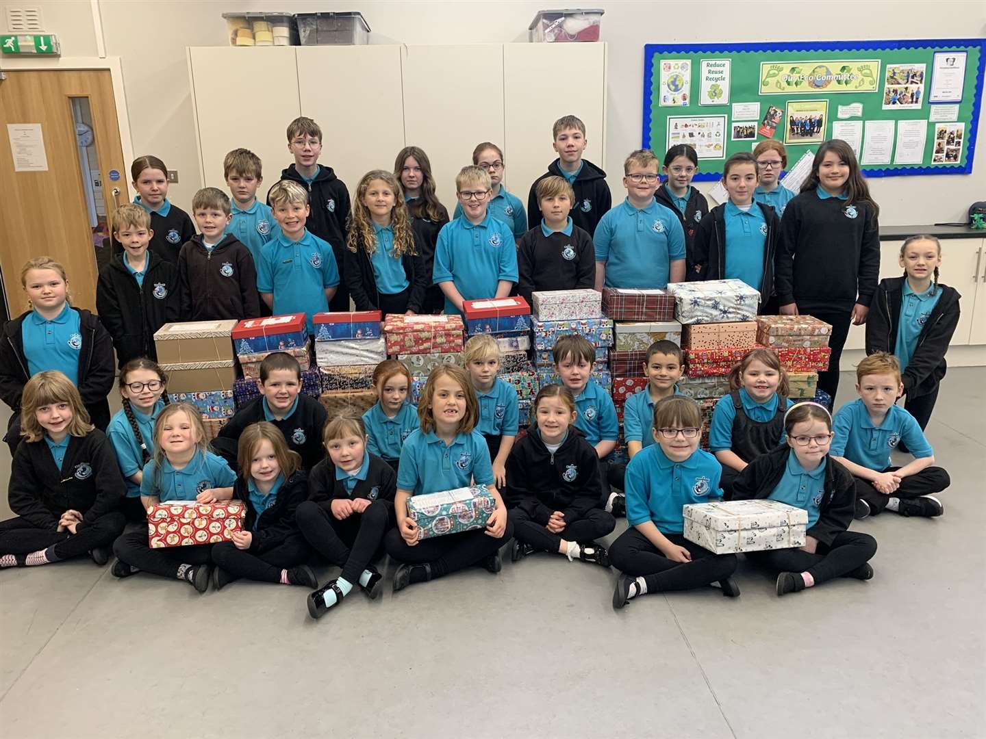 Pupils have spent the last couple of weeks filling 69 shoe boxes with practical items, as well as a few treats, and wrapping them in Christmas paper.