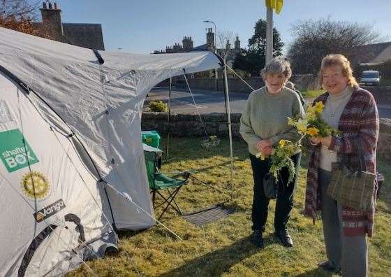 Visitors to the tent came bearing daffodils.