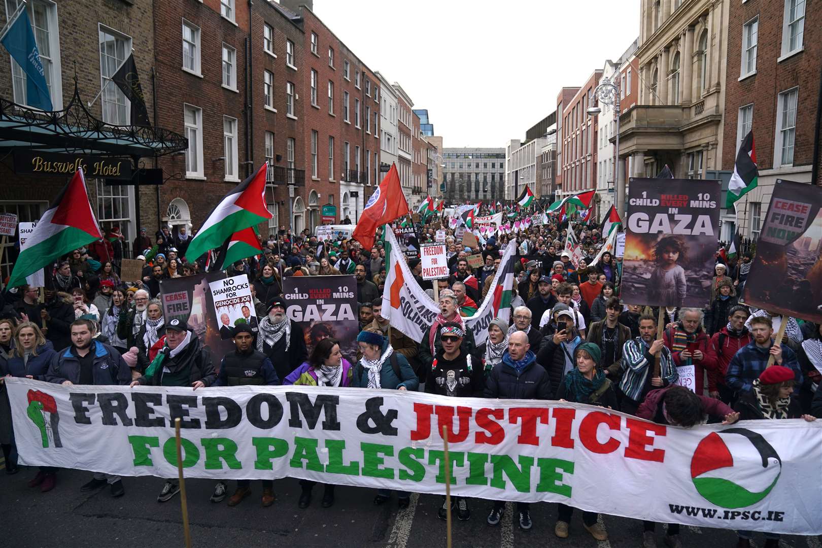People marched in Dublin city centre during a pro-Palestinian march to the Oireachtas parliament (Brian Lawless/PA).