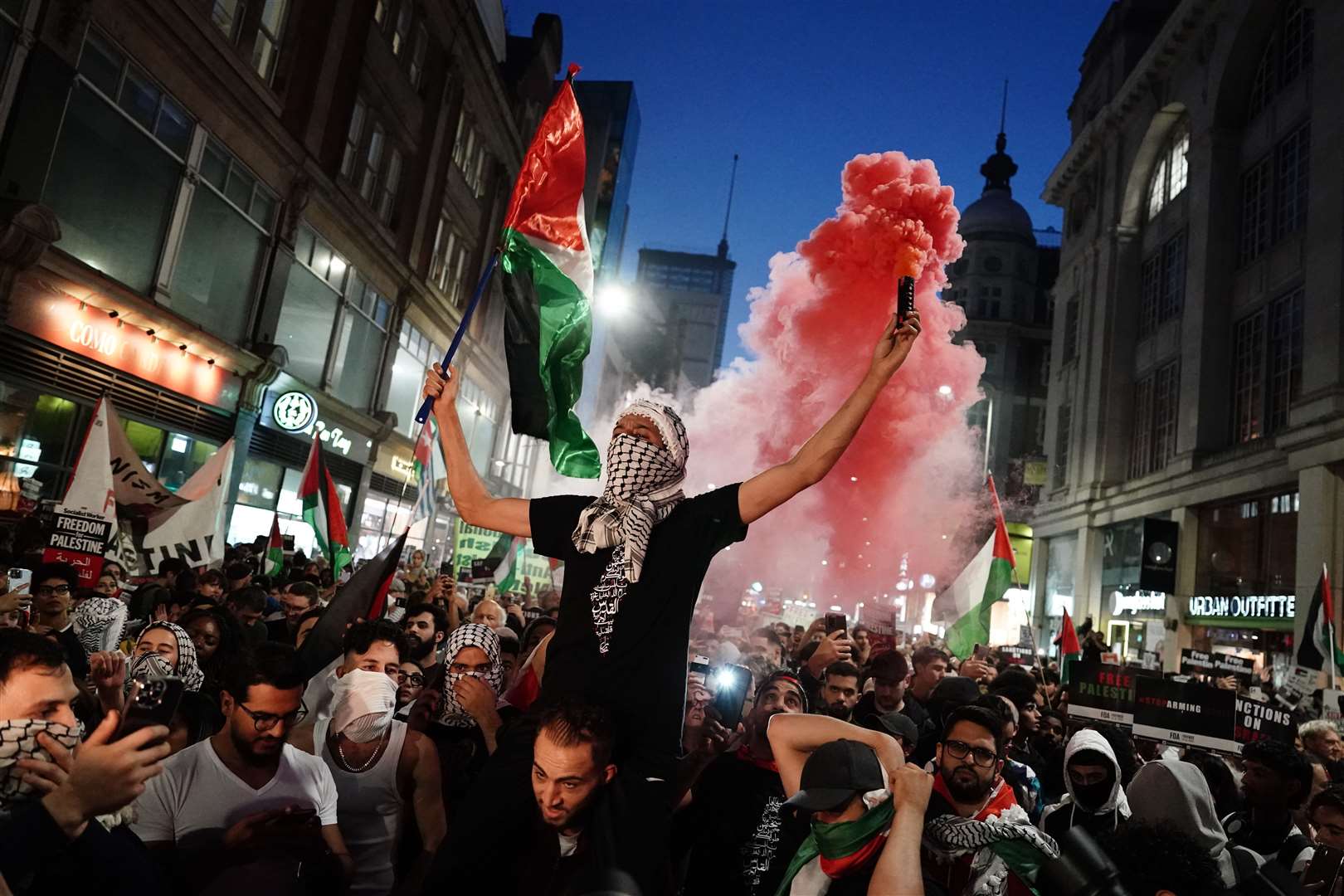 People take part in a Palestine Solidarity Campaign demonstration near the Israeli Embassy, in Kensington, London (Jordan Pettitt/PA)