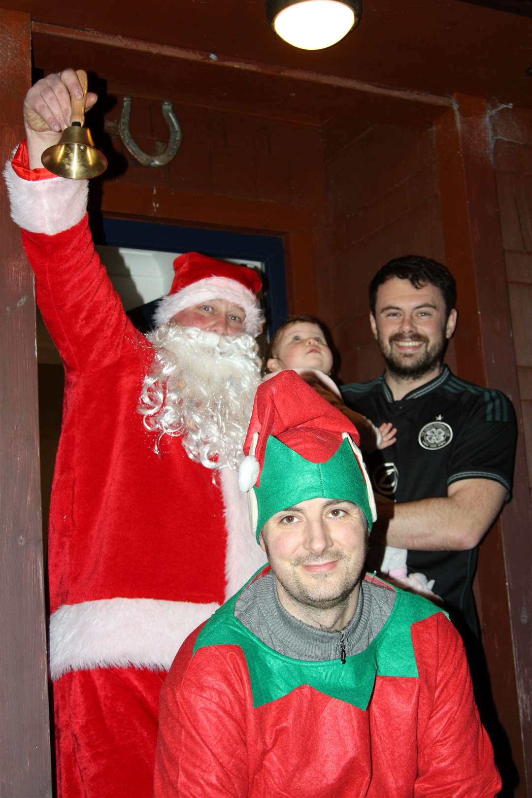 Santa and his elf Ewan Bruce called in on Andy Fraser and baby Effie.
