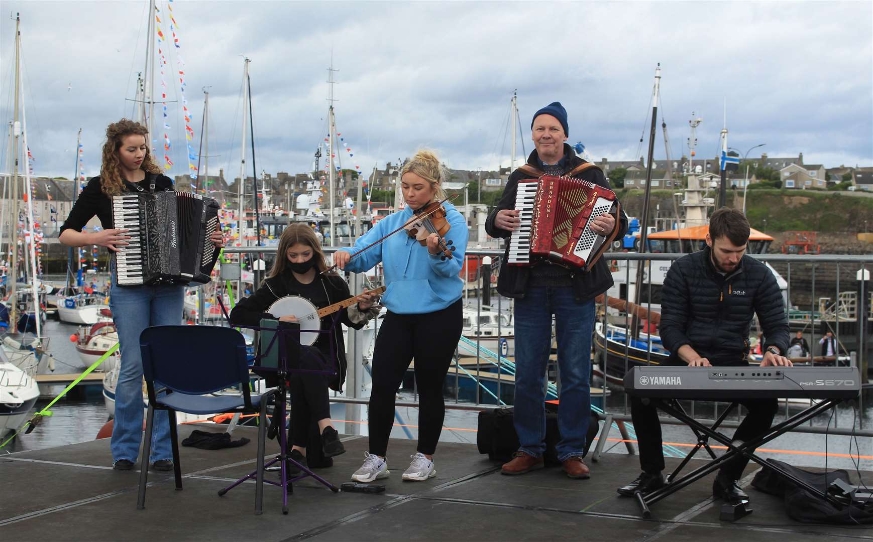Addie Harper and Friends playing traditional tunes on the quayside. Picture: Alan Hendry