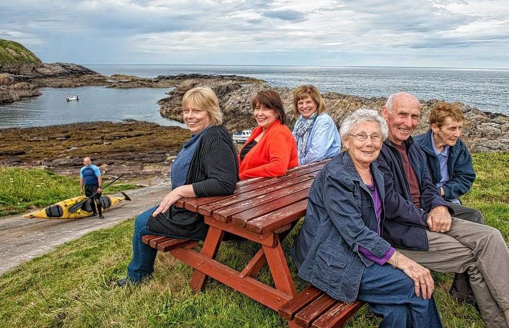 Fiona Morrison, third left, at an event in Portskerra in 2017 to mark the completion of the first phase of works to the slipway. She is seated next to former Highland councillor Linda Munro and Suzanne Mackay while opposite is Joan Ritchie, William Macdonald and Rena Macleod.