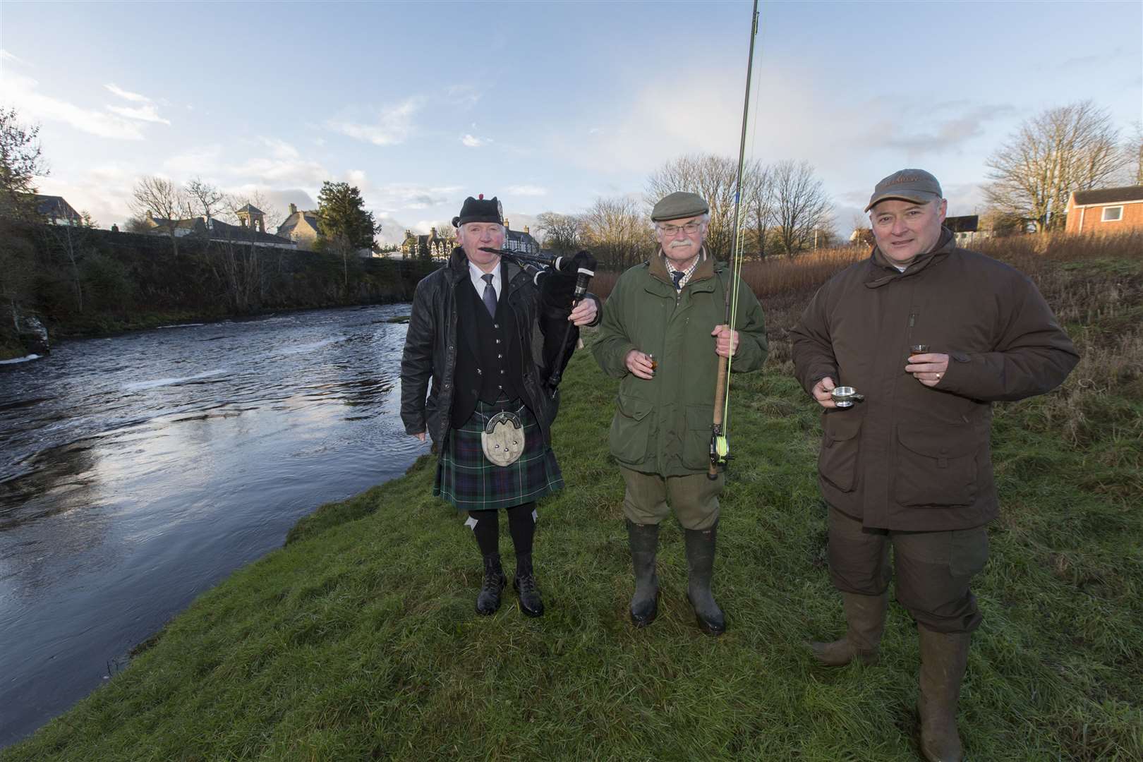 Piper Alasdair Miller with retired lawyer Francis Sandison (centre), who cast the first fly, and Thurso River Ltd estate manager John Drummond, who proposed the toast to the river. Picture: Robert MacDonald / Northern Studios