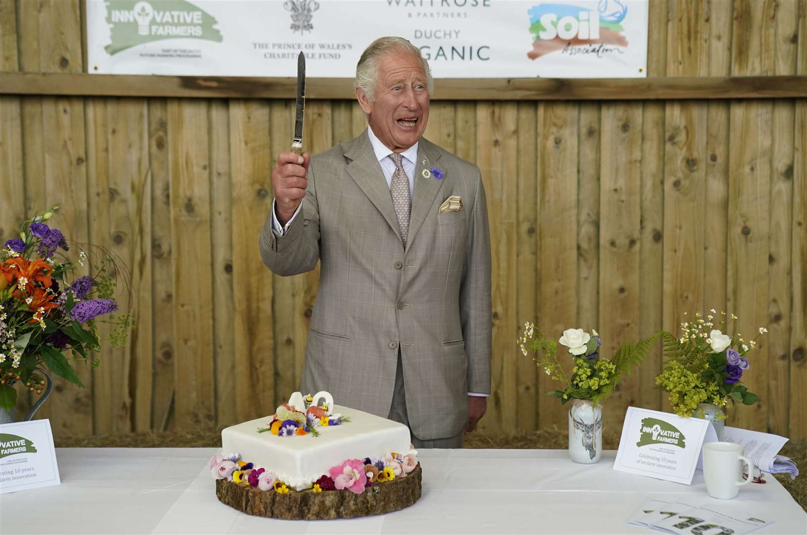 The Prince of Wales cuts a celebratory cake as he attends the Innovative Farmers 10th anniversary at Trefranck Farm, near Launceston (Andrew Matthews/PA)