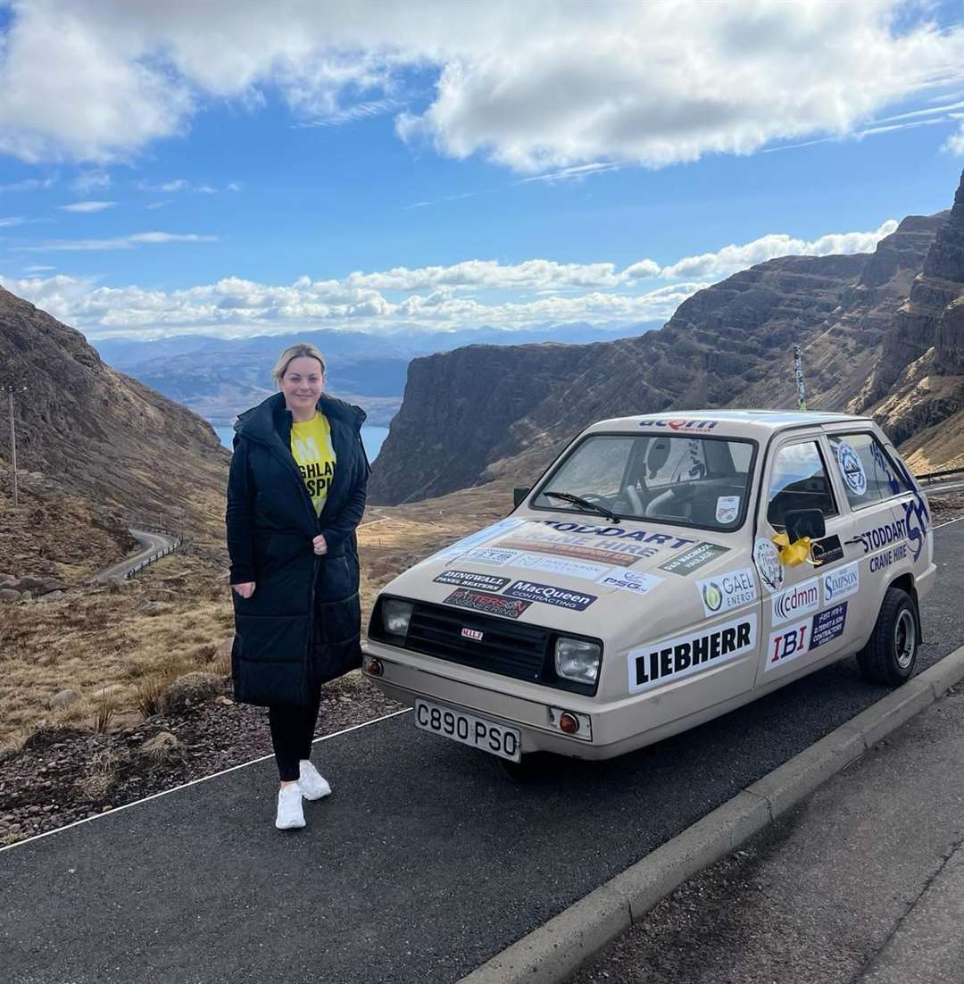 Angela Urquhart with the Reliant Robin at Shieldaig.