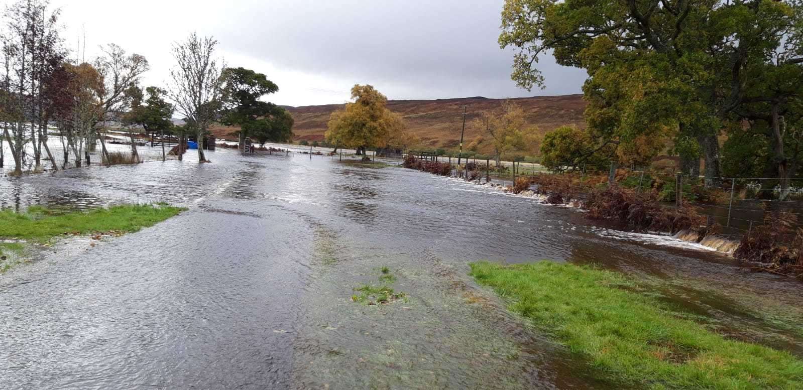 The River Brora burst its banks and covered the road at Balnacoil.