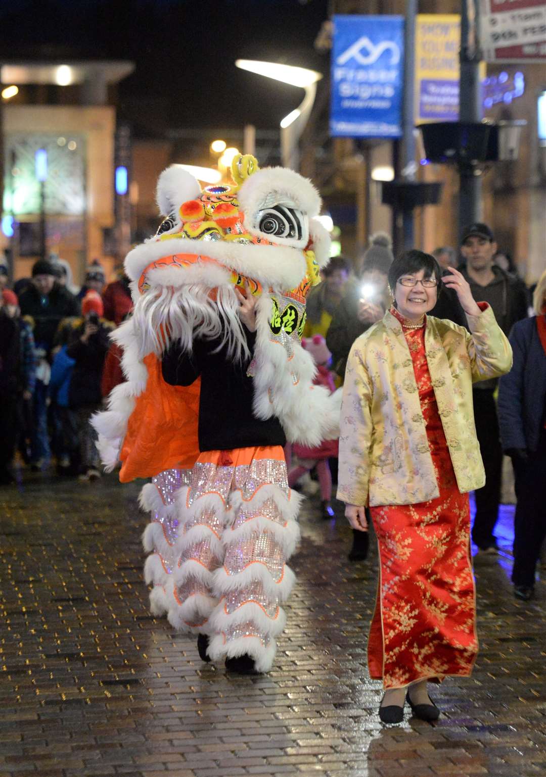 Monica Lee-MacPherson, chairperson of the Scottish Highlands & Islands and Moray Chinese Association (SHIMCA) leads a previous lion dance in Inverness. Picture: Gary Anthony