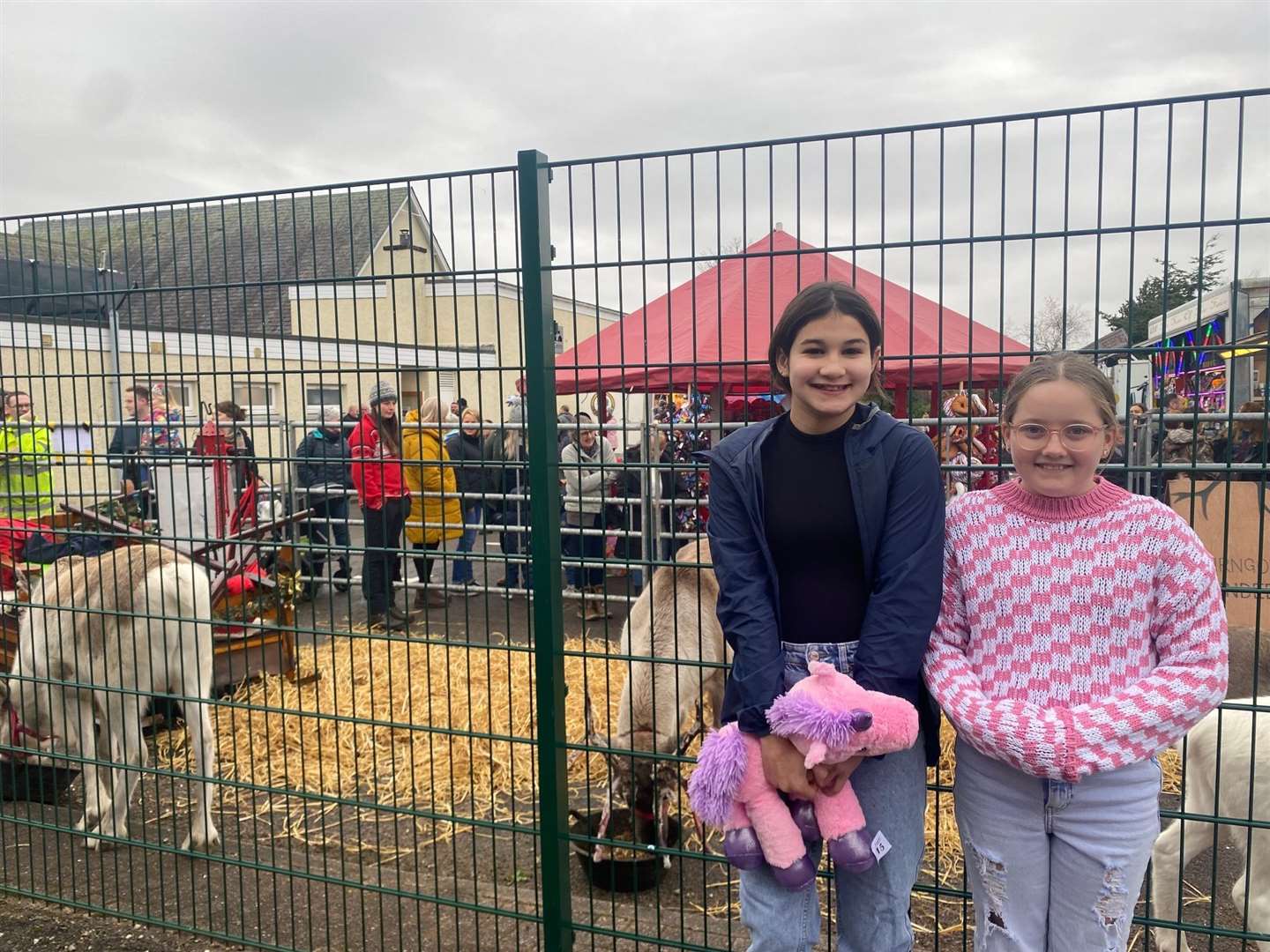 Hannah McLeod and Katie Dick from Lairg were among a large number of local youngsters who made sure to visit the reindeer in their pen at the back of the community centre.
