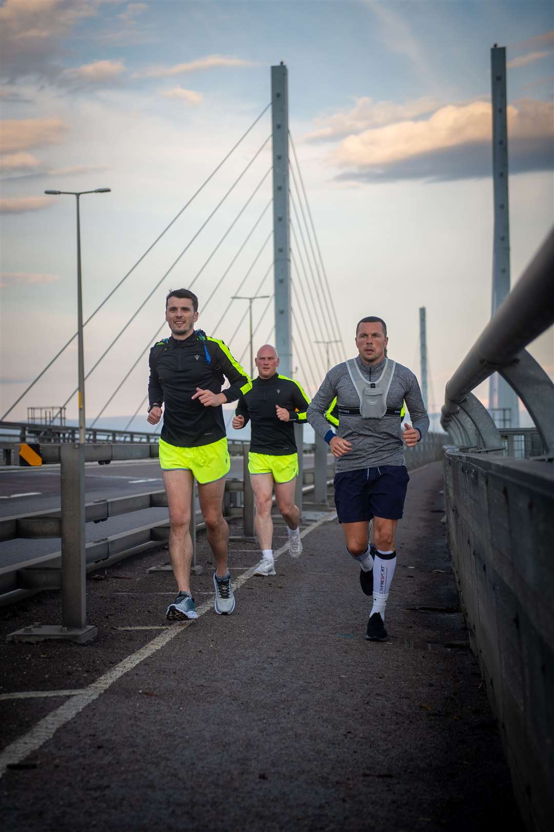 The Brora Rangers Team manager, Steven Mackay ran an ultra marthon of 80 miles in 24hrs to raise money for MFR cash for kids with the support of Craig Campbell and David Hind...Steven Mackay, Craig Campbell and Don Cowie cross the Kessock Bridge...Picture: Callum Mackay..