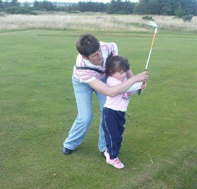 Zara has been golfing since she was presented with plastic clubs by her parents as a toddler. She is seen here with mum Margaret.