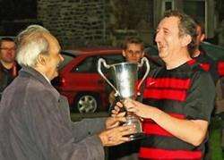 Kenny Macleod receives the Mod Cup from MSP and personal friend John Farquhar Munro in October 2010. Photo: James Gunn
