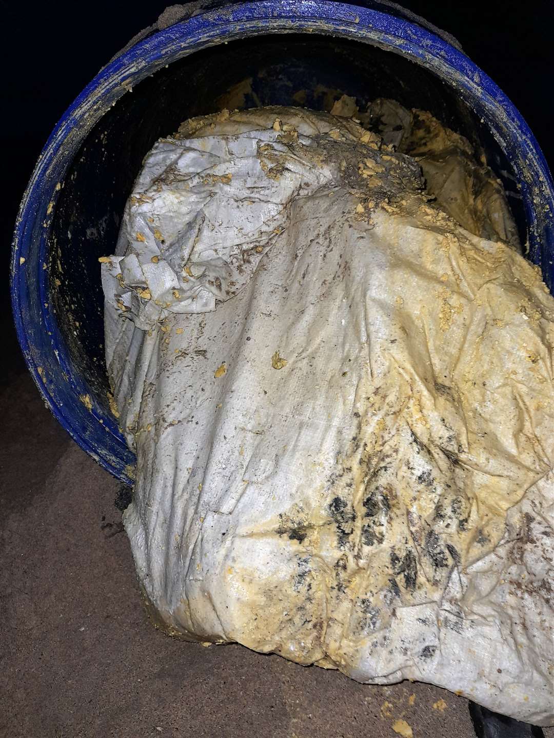 The barrel was filled with bags of powder.