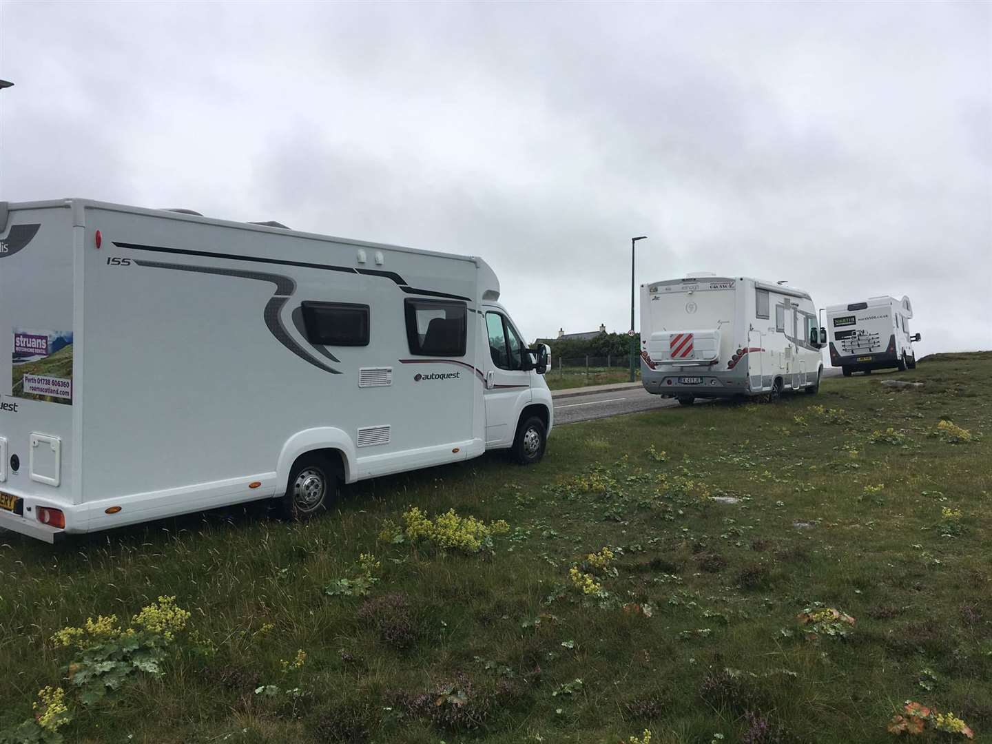 Motorhomes parked up on verges near Durness in 2020.