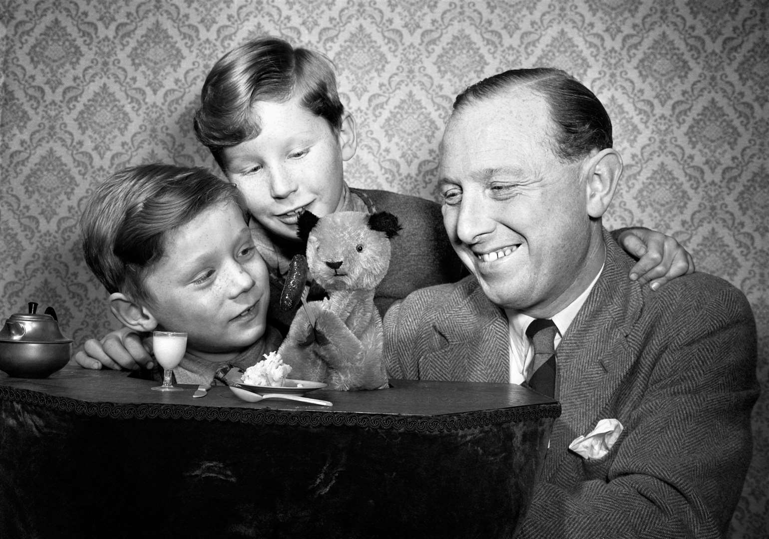 Sooty creator Harry Corbett with Sooty and sons David, nine, and Peter (better known as Matthew Corbett), aged six (PA)