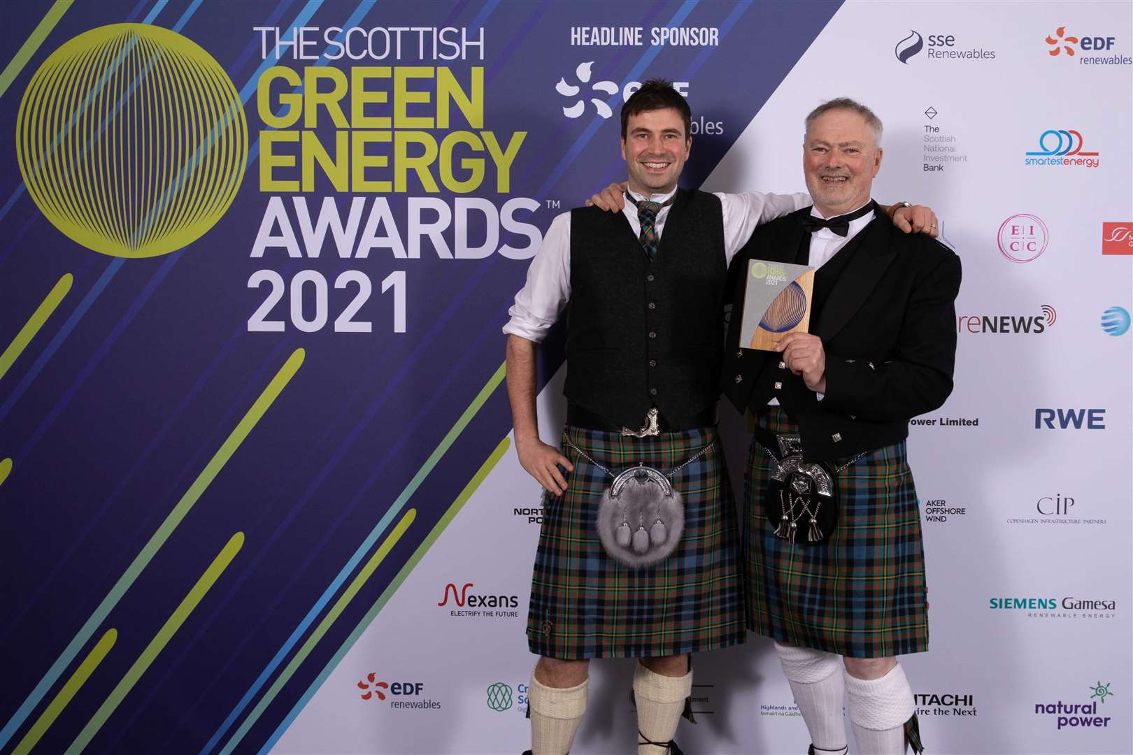 A delighted Hugh and Michael Maclellan whose Allt an Lagain hydro scheme at Laid has won a top renewable energy award.