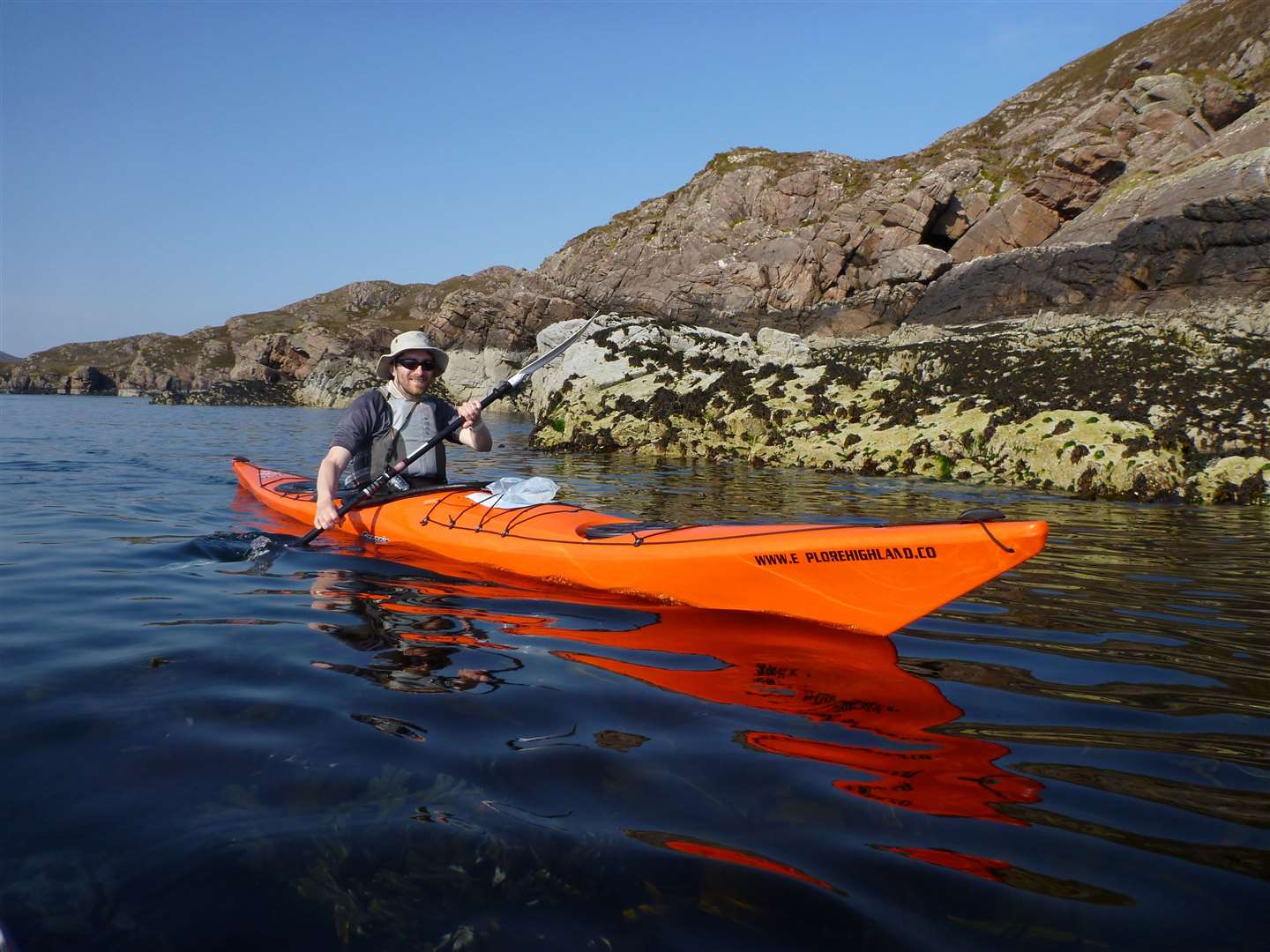 John sea kayaking in the Summer Isles.