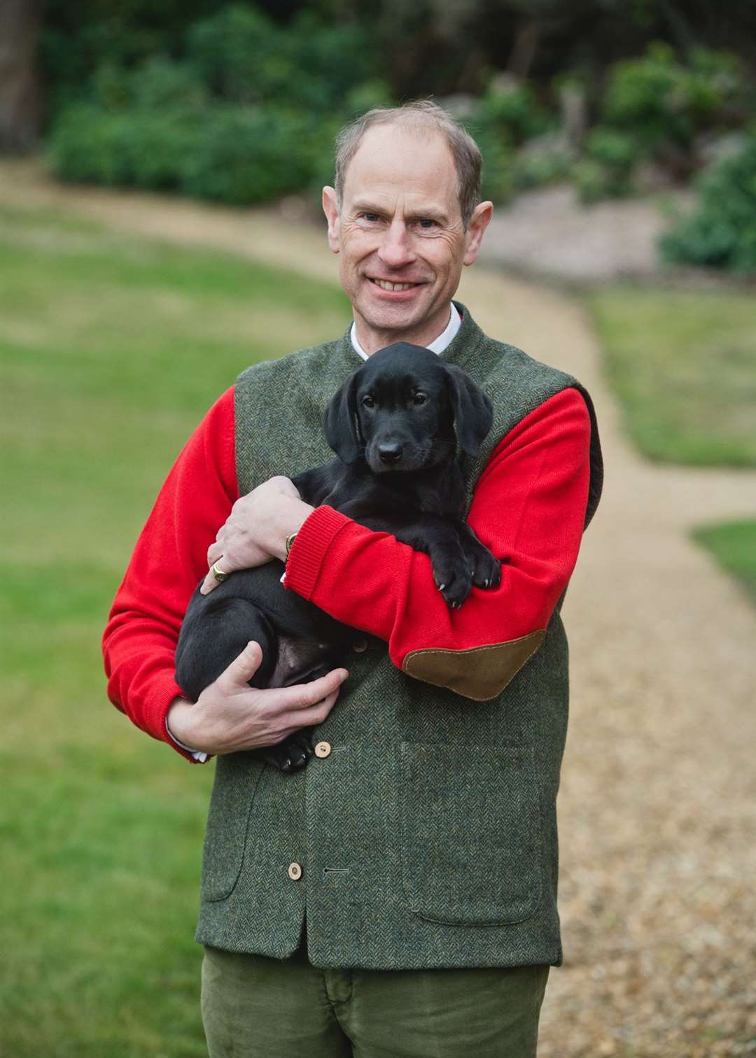 The Duke of Edinburgh with his Labrador puppy Teasel (Chris Jelf/Buckingham Palace/PA)