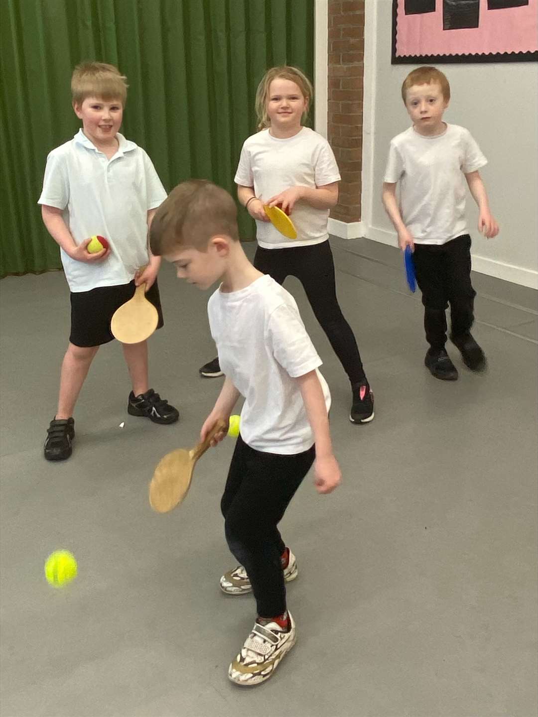 P3 pupils practising their ball skills.