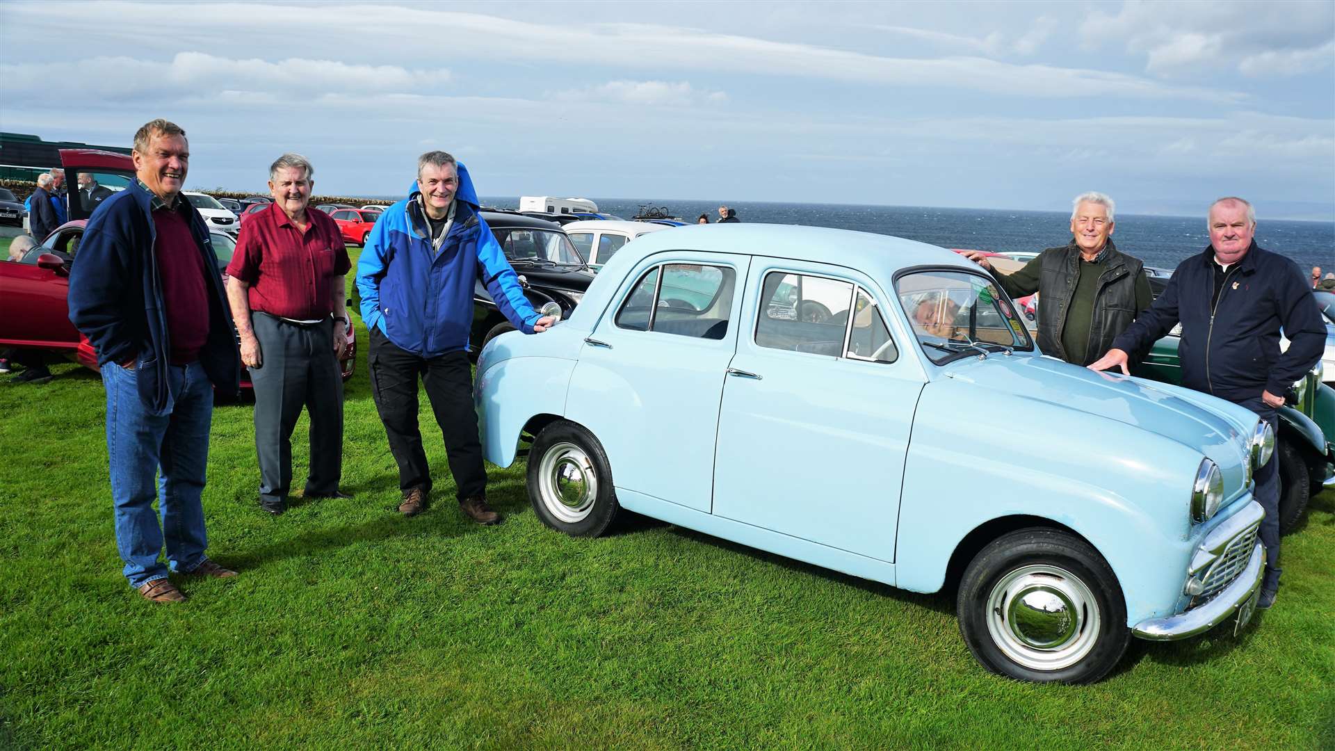 Members of Caithness and Sutherland Vintage and Classic Vehicle Club with Bluebell outside the Castle of Mey on Sunday. Picture: DGS