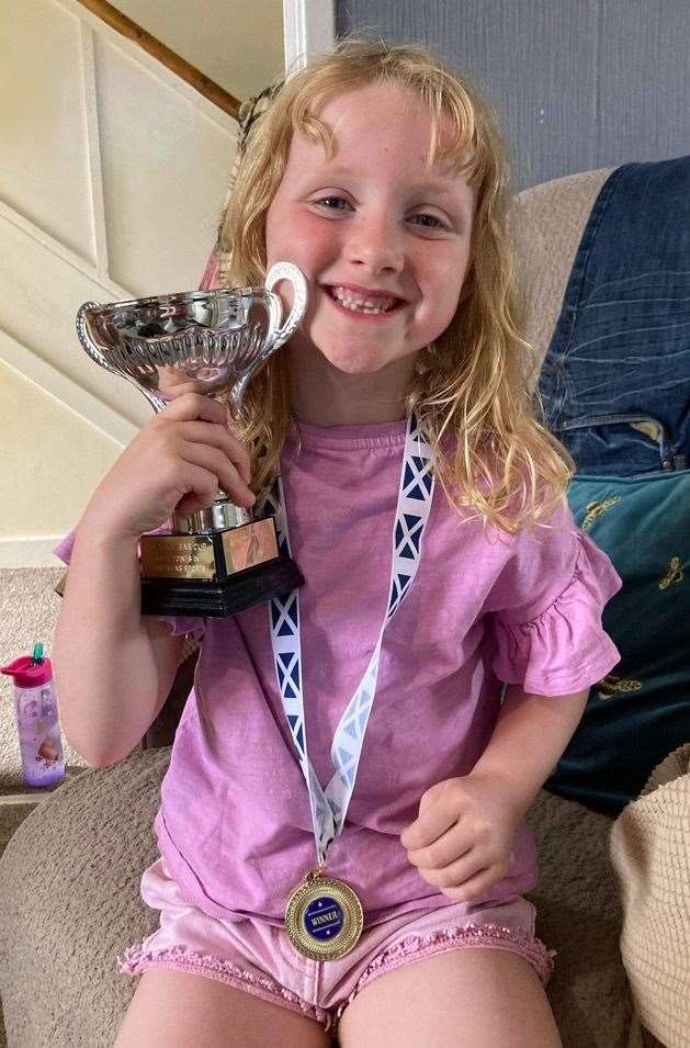 Willow Morrison was awarded this trophy after scoring the most points in children's sports at the Lairg Crofters Show.