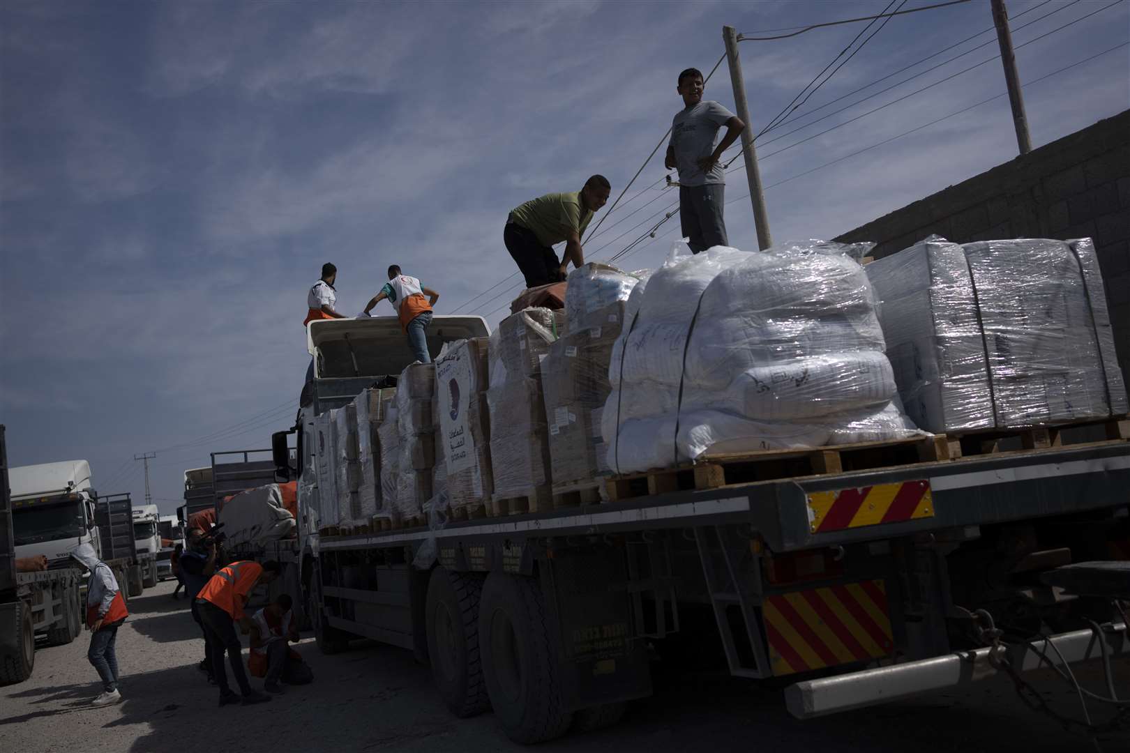 Trucks with humanitarian aid for the Gaza Strip enter from Egypt in Rafah (Fatima Shbair/AP)