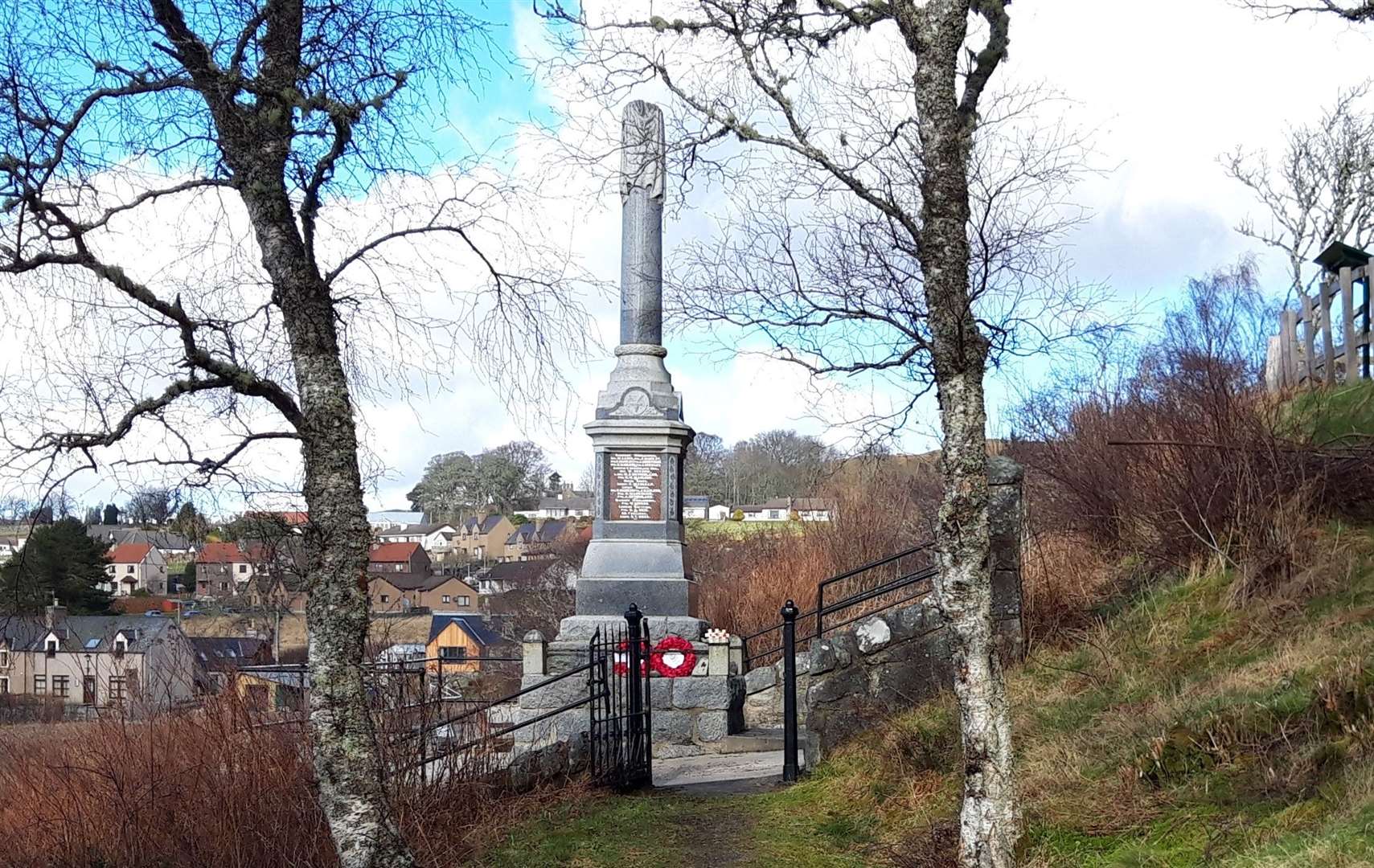 A side view of the Lairg War Memorial which overlooks Loch Shin.