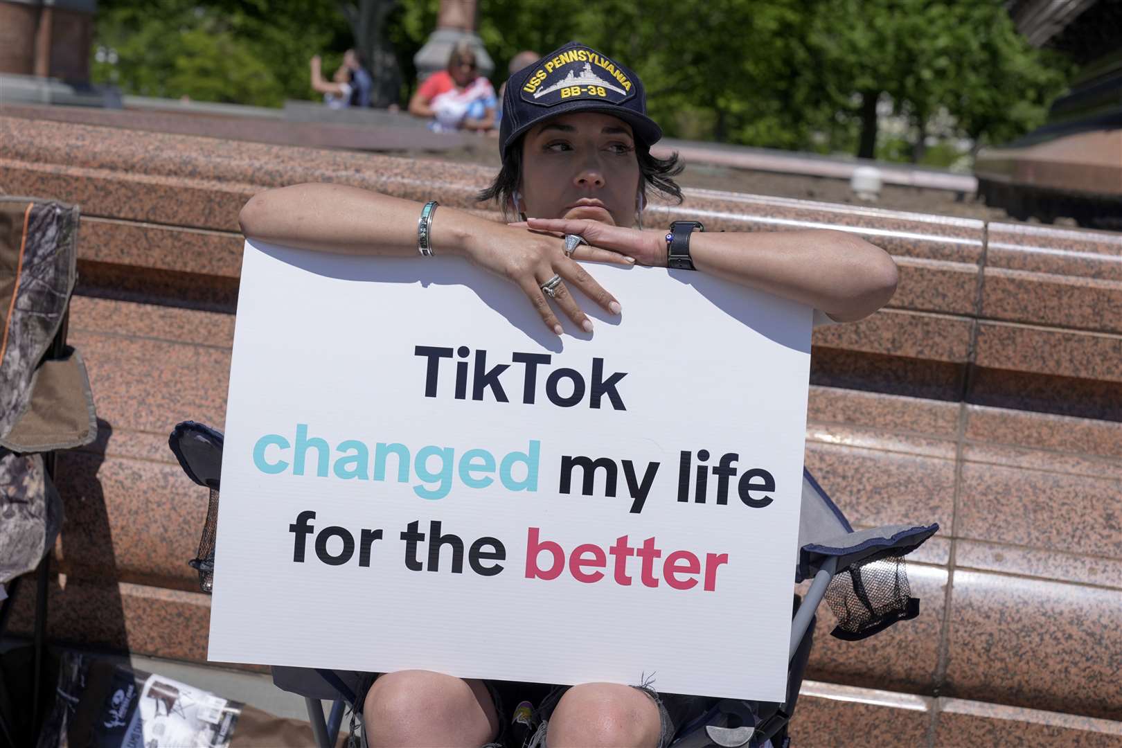 A TikTok content creator, sits outside the US Capitol (Mariam Zuhaib/AP)