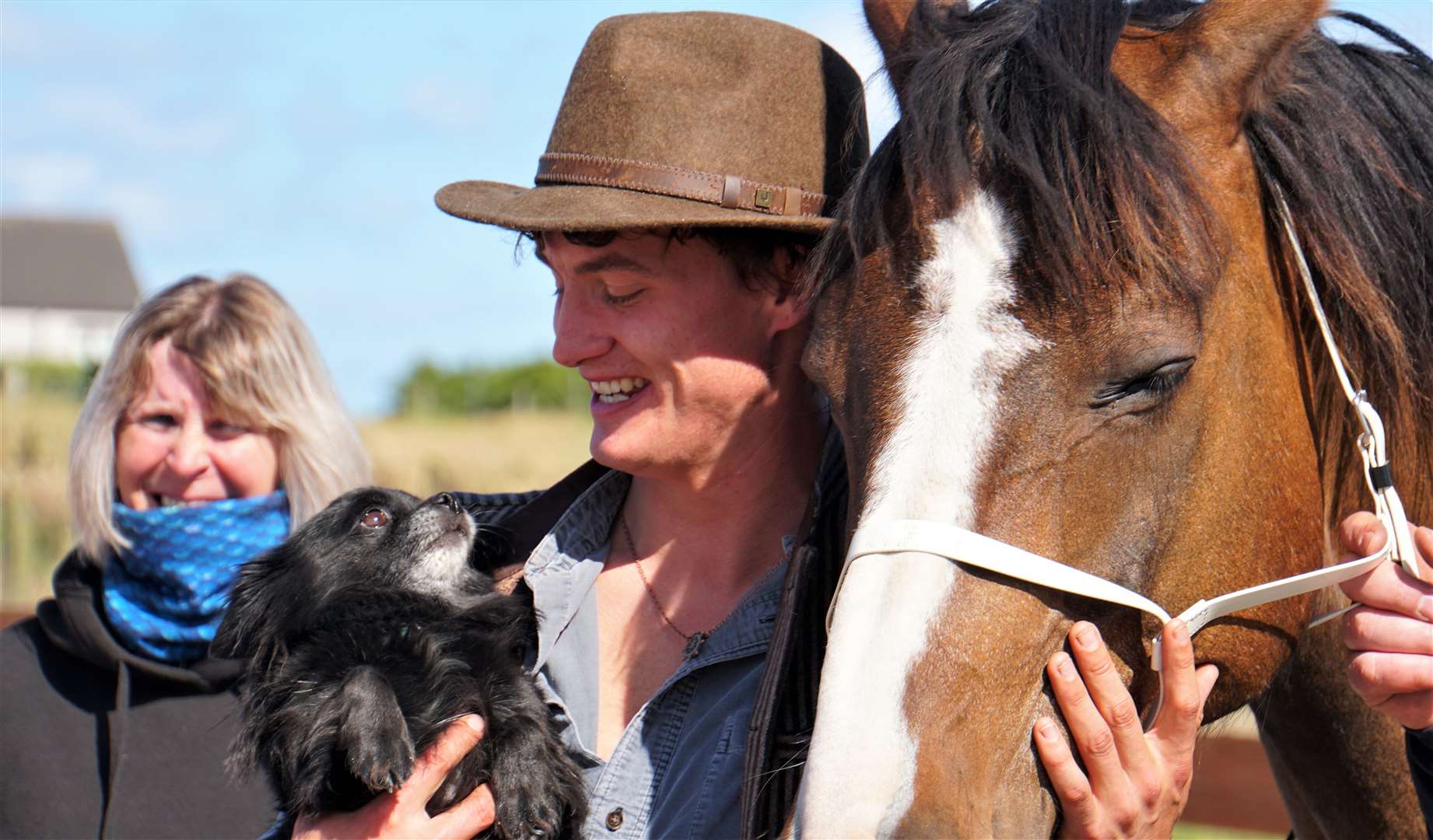 Charity rider Louis Hall meets stable mascot Louis Vuitton the Chihuahua. Picture: DGS