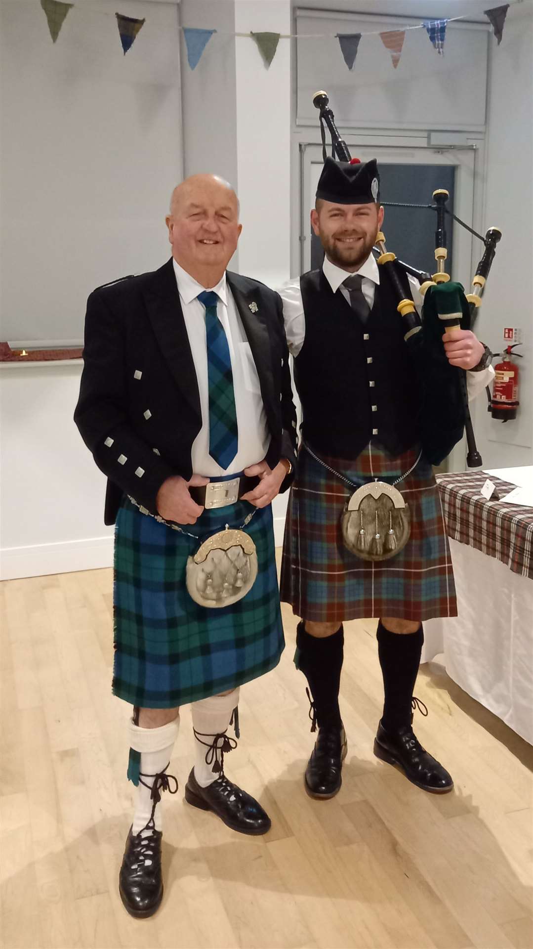 Star turn and host Willie Mackay is welcomed into the Old School, Embo, by piper David Fraser.
