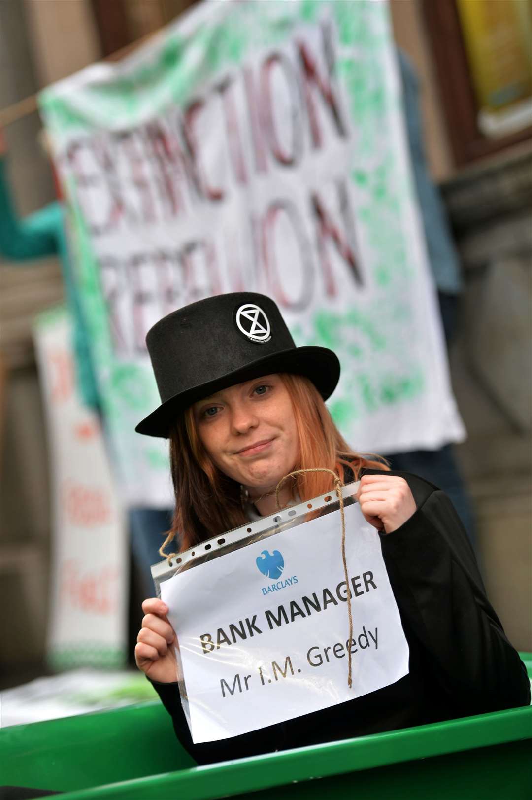 Caitlyn Macleod and Extinction Rebellion Highland staged another Clean Up Your Act event outside Barclays Bank, Union Street, Inverness. Picture: Callum Mackay