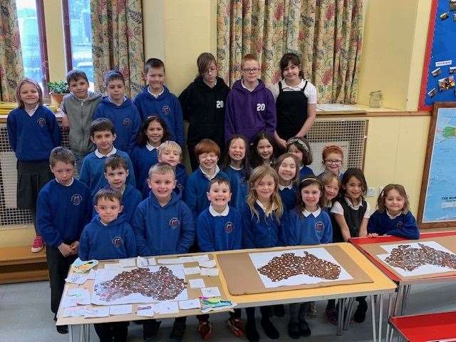 Gledfield pupils with their coin map of Australia.