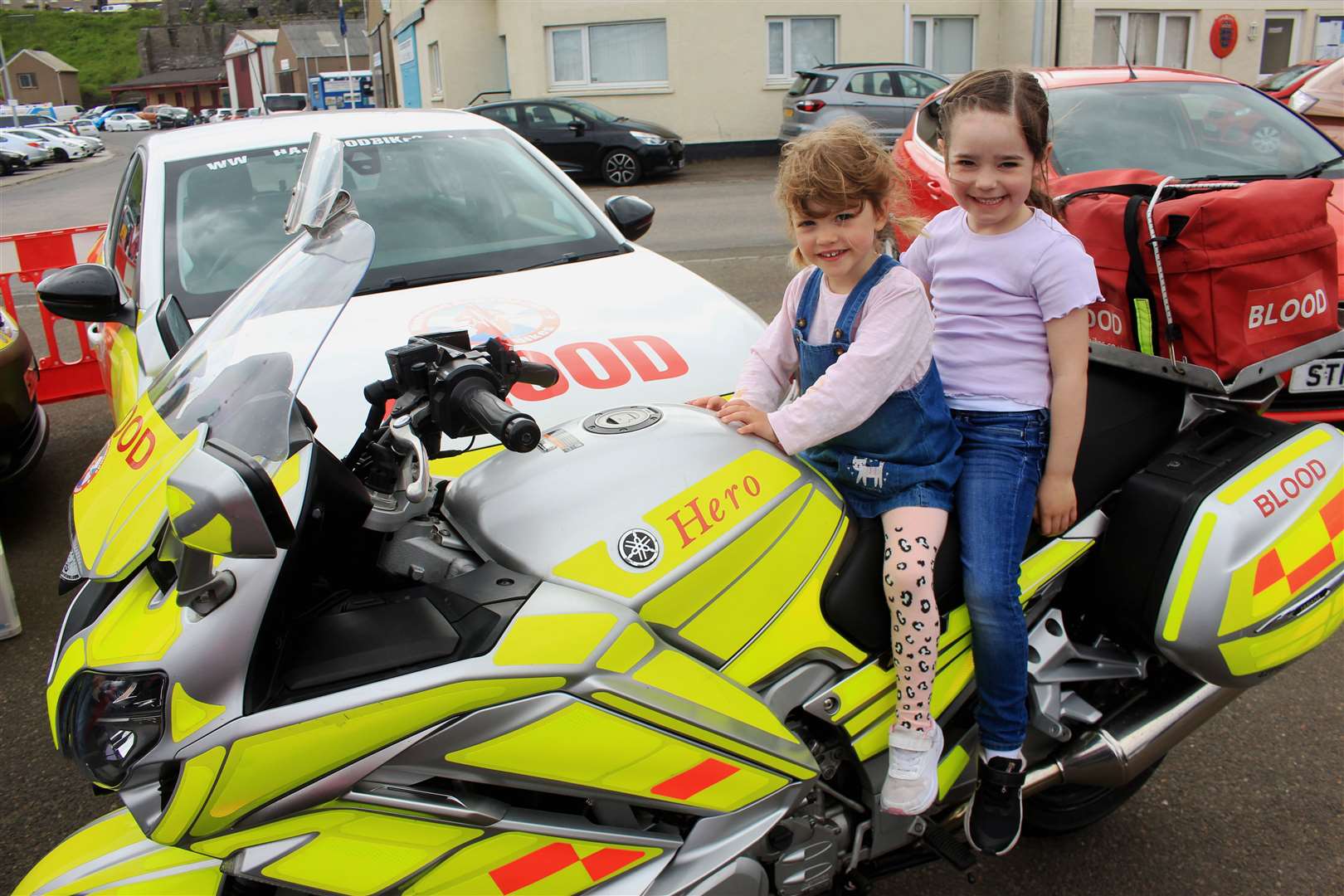 Cammie Mackay (3) and her cousin Hannah Mackay (6) on a motorcycle brought along by Highland and Islands Blood Bikes. Picture: Alan Hendry