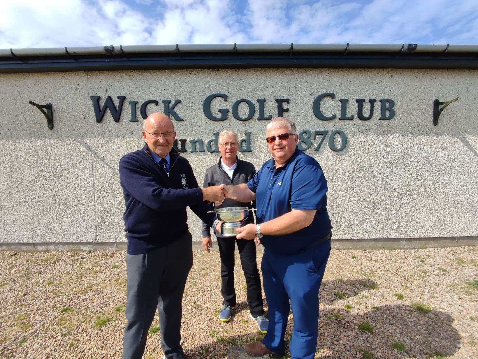 Willie Mackay, Royal Dornoch Golf Club (left), presents the John Sutherland Quaich to Ali Mackay, captain of Wick Golf Club. Looking on is Wick historian Roy Mackenzie. The award will be competed for annually.
