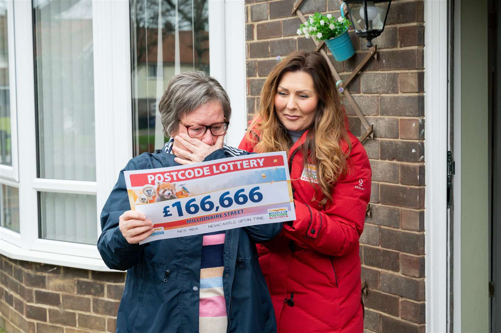 Christine Hedley said she ‘couldn’t believe it’ when she opened the envelope to reveal two winning tickets (People’s Postcode Lottery/PA)
