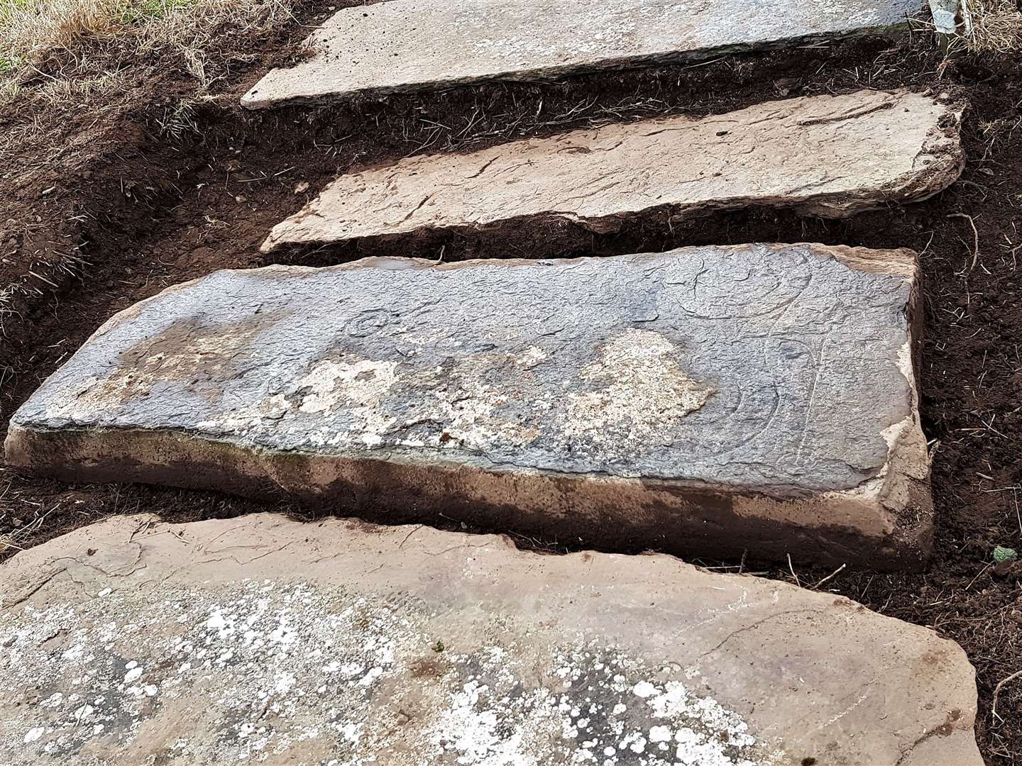 Fiona Begg took pictures of the stone slab soon after uncovering it and finding wavy lines on its surface. She knew these were of Pictish origin. Picture: Fiona Begg