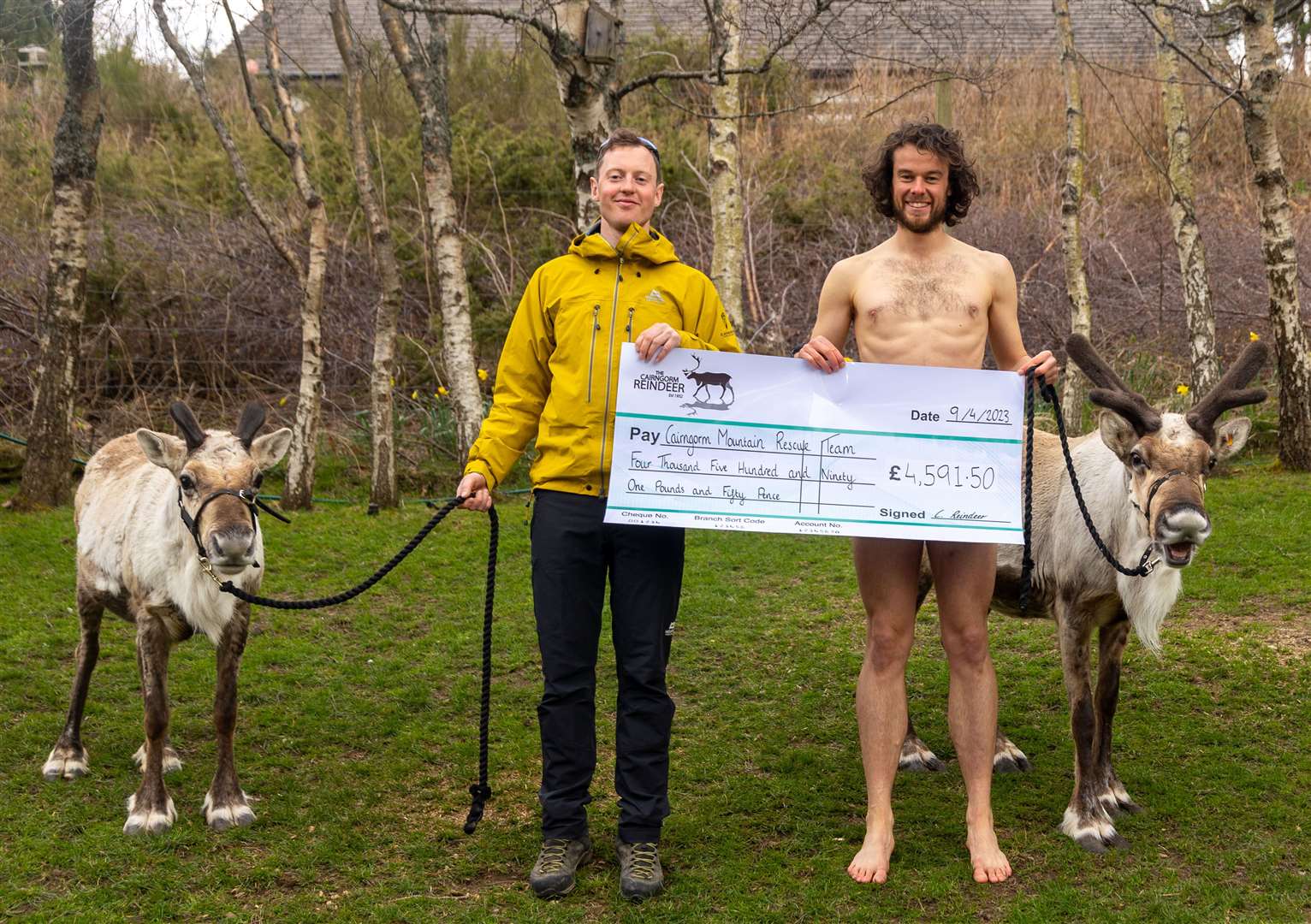 Jamie Graham (left) gratefully accepts the cheque on behalf of CMRT from fearless photographer Joe Mann this week. Picture: Aidan Woods