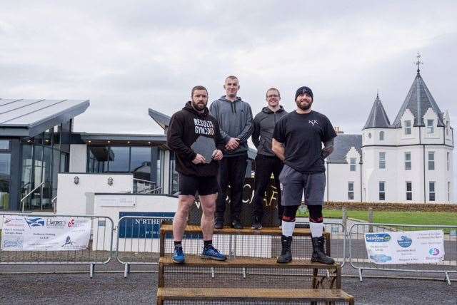 Winner Phil Jack (left) after receiving the John O'Groats Strongest Man trophy last year, with fellow competitors Jason Anderson, Kris Hamilton and Calum Elder. Picture: Tom McGee