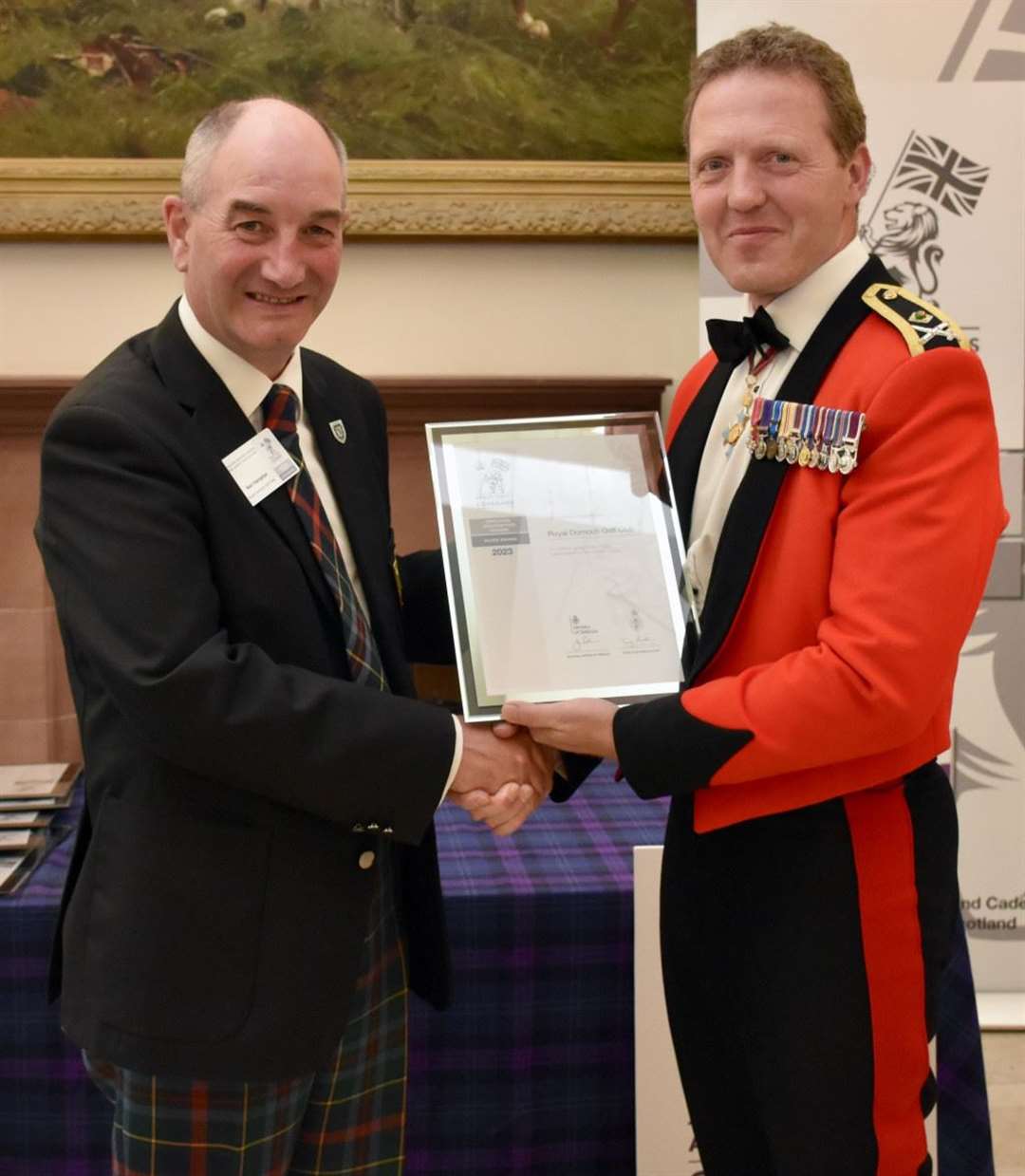 Neil Hampton, general manager of Royal Dornoch Golf Club, is presented with a Defence Employer Recognition Scheme Silver Award by Major General Bill Wright, General Officer Scotland, at a ceremony in Perth.