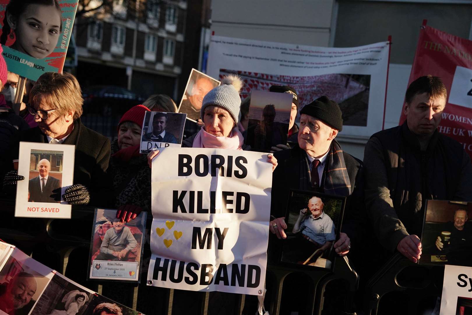 Protesters outside the UK Covid-19 Inquiry at Dorland House in London (Jordan Pettitt/PA)