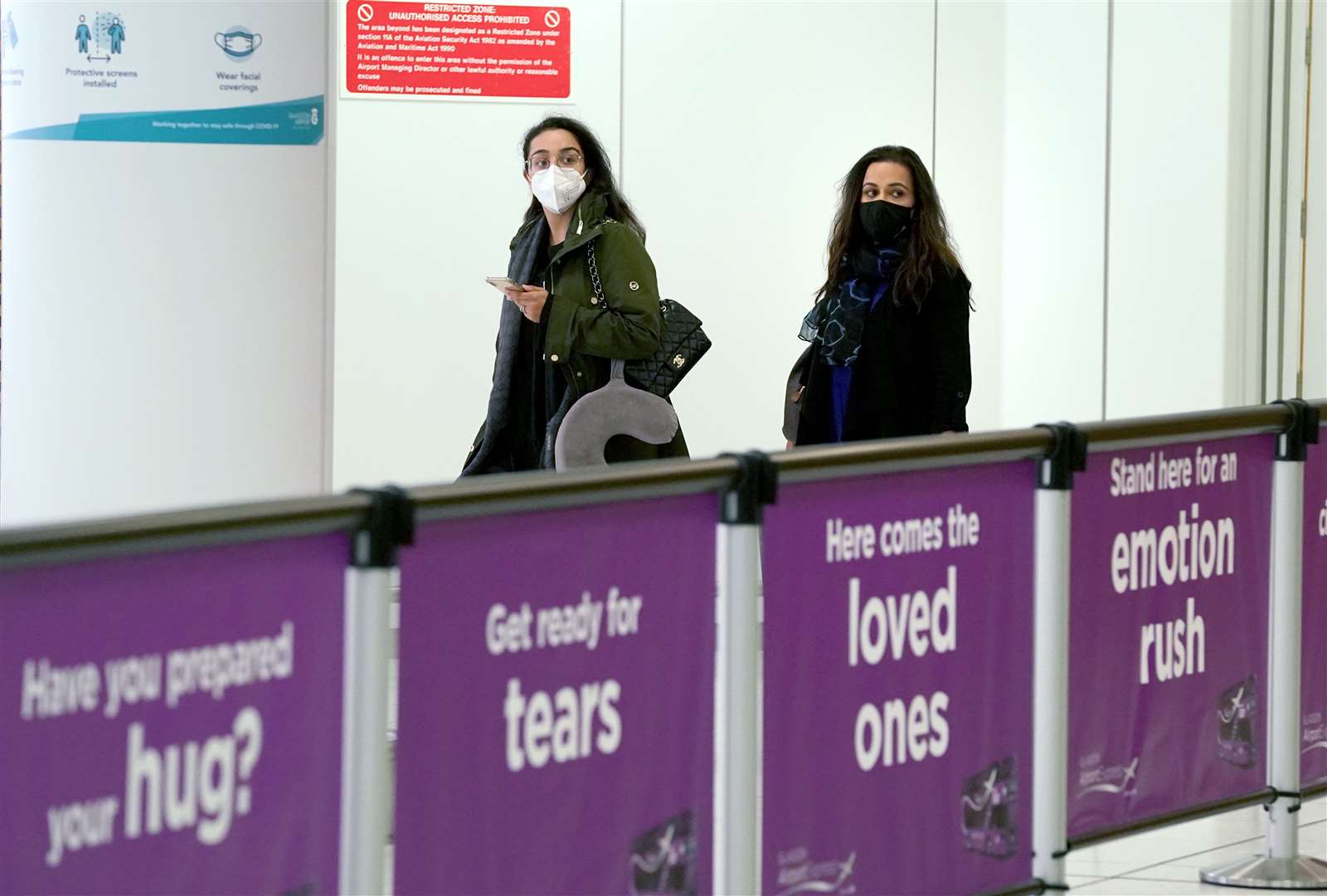 Passengers in the arrivals hall after arriving on a flight from Amsterdam at Glasgow Airport (Andrew Milligan/PA)