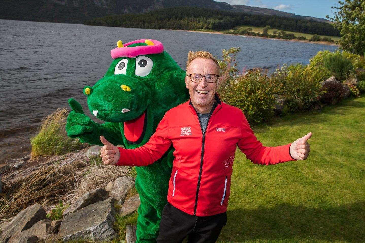 Nessie, pictured here with Bryan Burnett, ran the Loch Ness Marathon's route to officially open early-bird entry to the run.