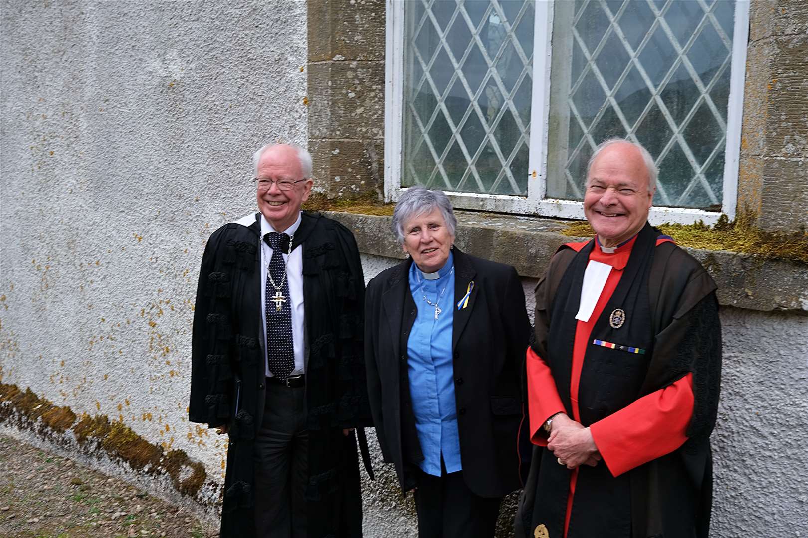 Lord Wallace (left), seen here with the Reverend Mary Stobo, session clerk for Kincardine, Croick and Edderton churches, and Professor Iain Torrance, viewed the window of the historic Croick church which has names engraved on it from Glencalvie releases.  Photo: Marc Foggin.