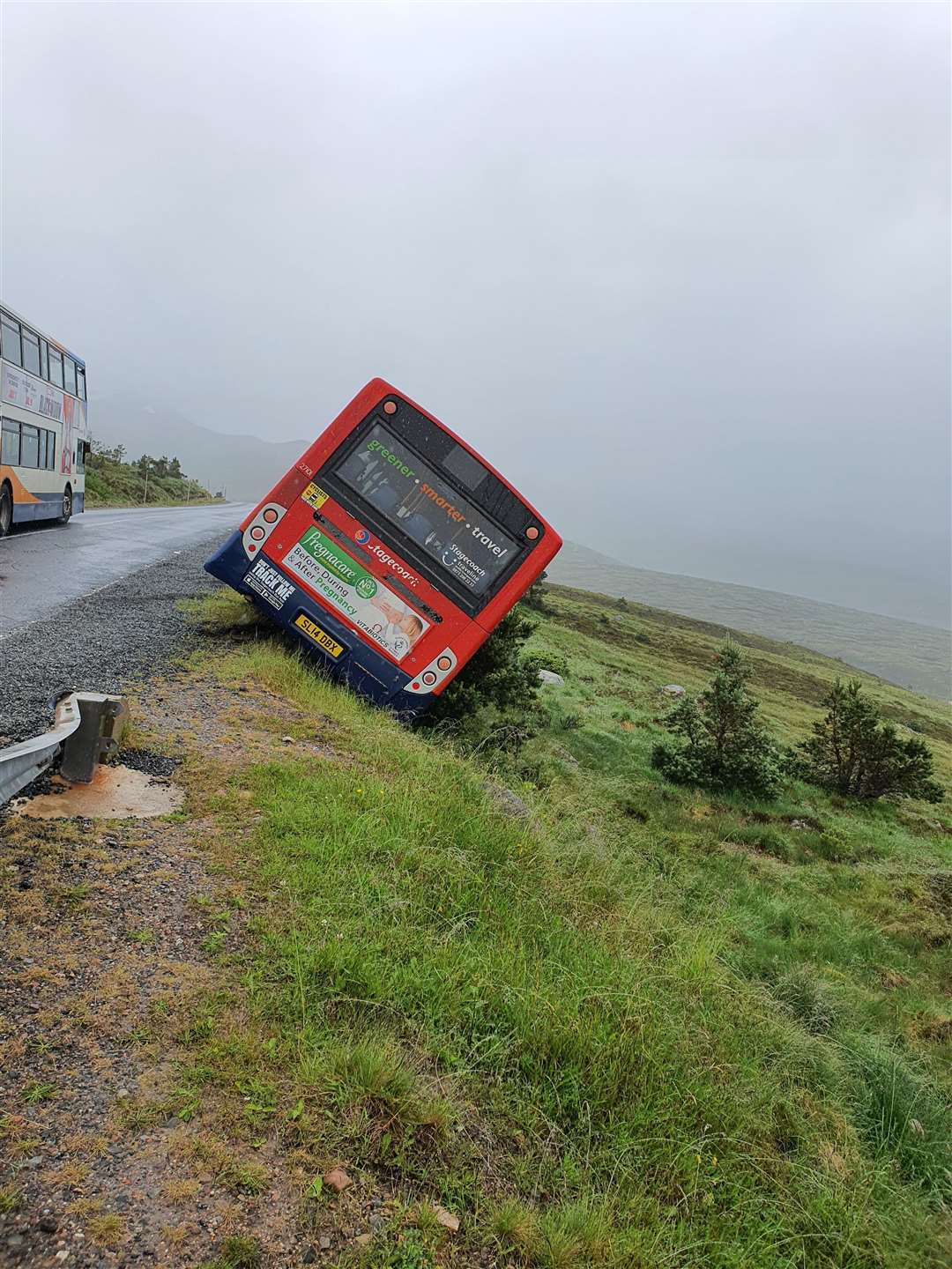 Perilous: the bus was left clinging to the edge of the road